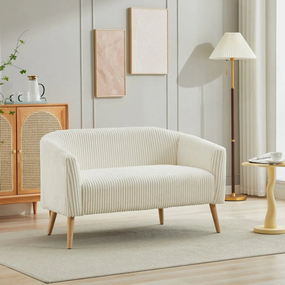 Dwuosobowa sofa tapicerowana sztruksem na drewnianych nogach w kolorze orzecha