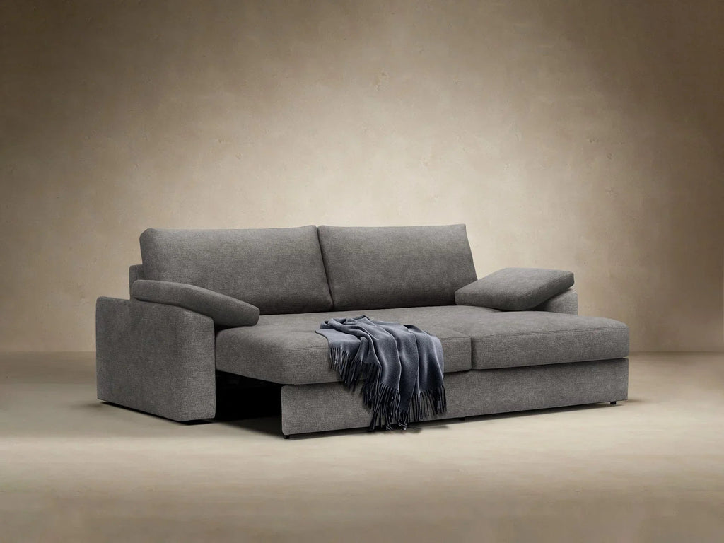 Sofa rozkładana Vilander z podłokietnikami poduszkowymi