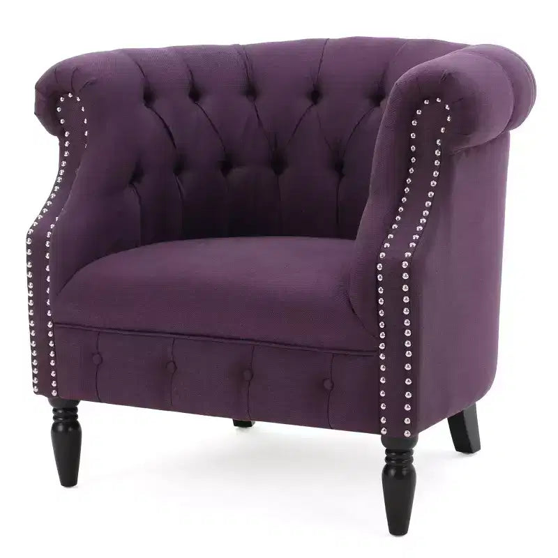 Nowoczesny tapicerowany fotel klubowy z przeszyciami i ozdobnymi ćwiekami