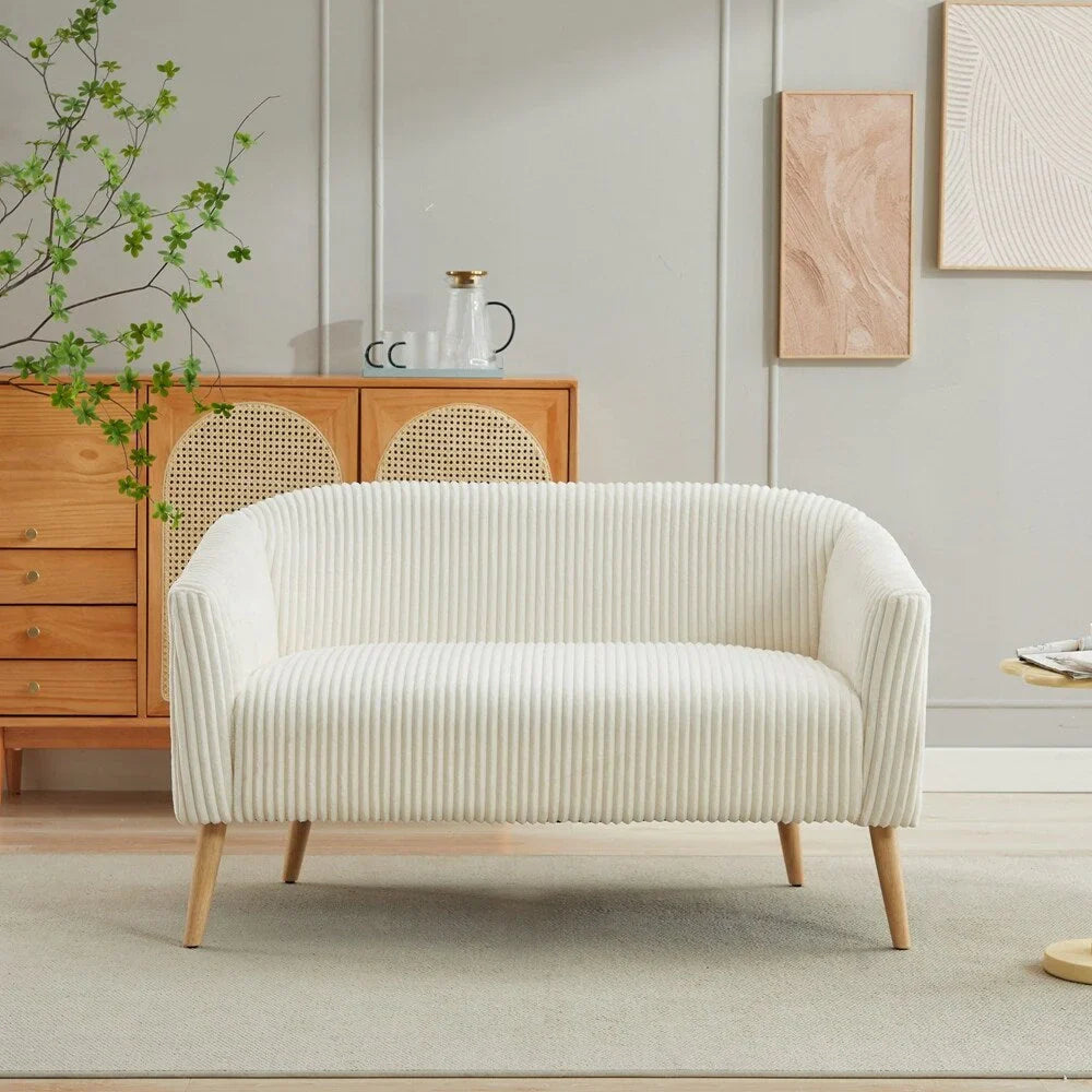 Dwuosobowa sofa tapicerowana sztruksem na drewnianych nogach w kolorze orzecha