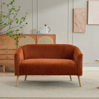 Dwuosobowa sofa tapicerowana sztruksem na drewnianych nogach w kolorze orzecha