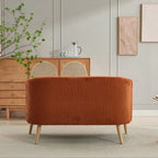Dwuosobowa sofa tapicerowana sztruksem na drewnianych nogach w kolorze orzecha