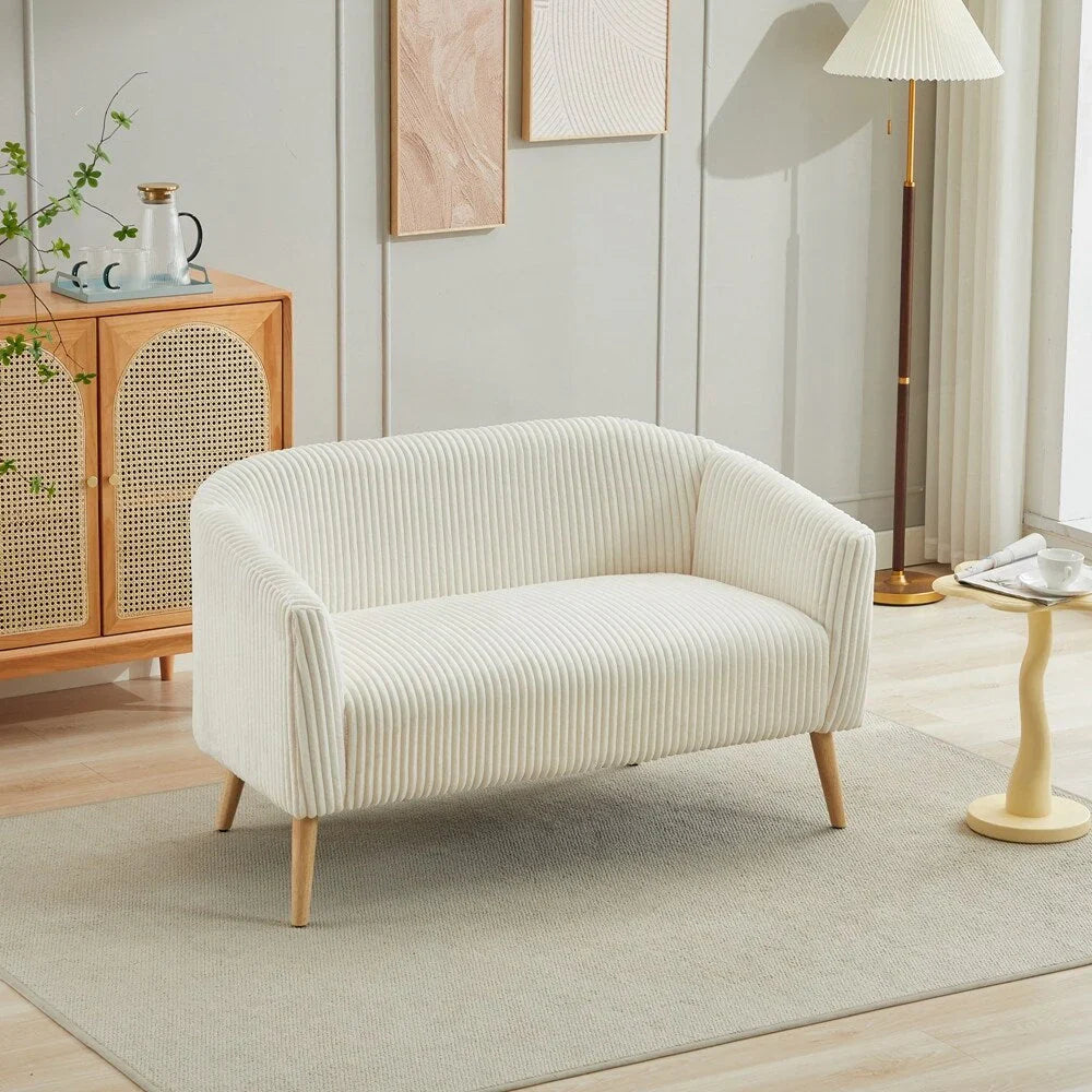 Dwuosobowa sofa tapicerowana sztruksem na drewnianych nogach w kolorze orzecha