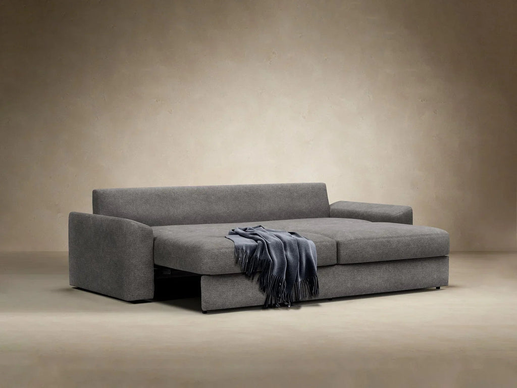 Sofa rozkładana Vilander z podłokietnikami poduszkowymi