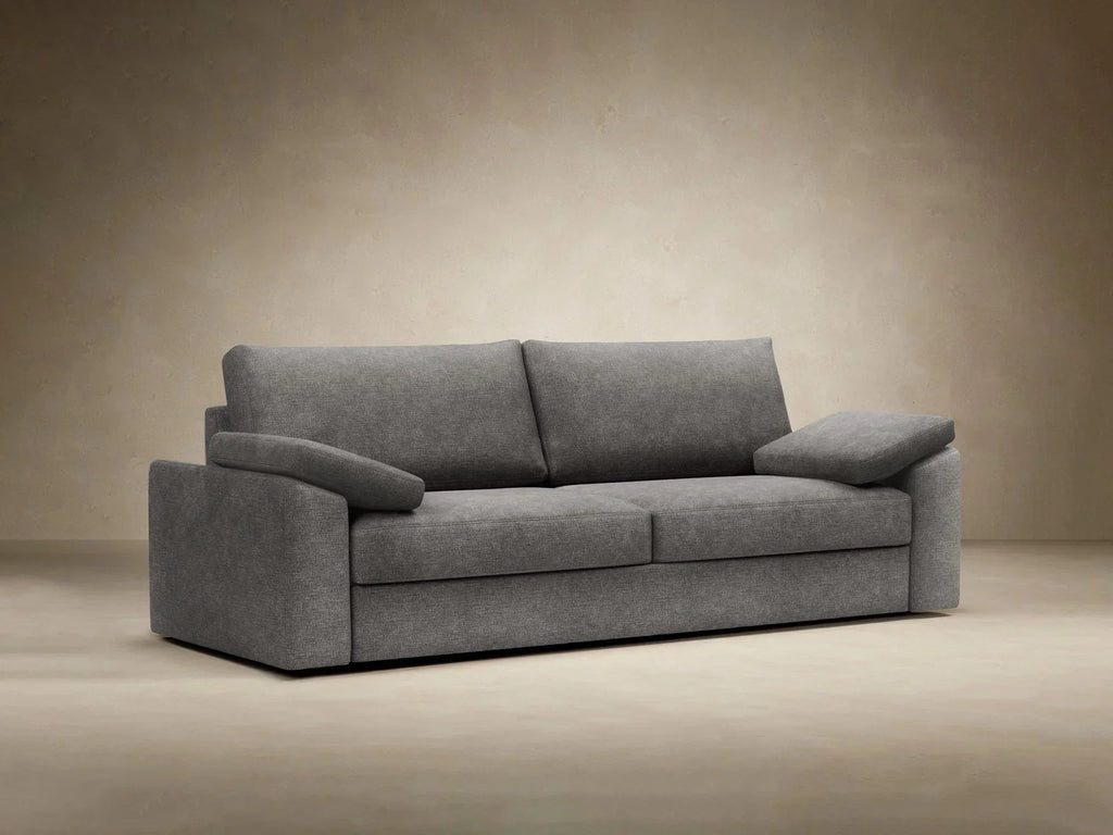 Sofa rozkładana Vilander z podłokietnikami poduszkowymi